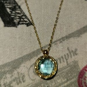 14kt Yellow Gold Checkerboard cut blue topaz Penda